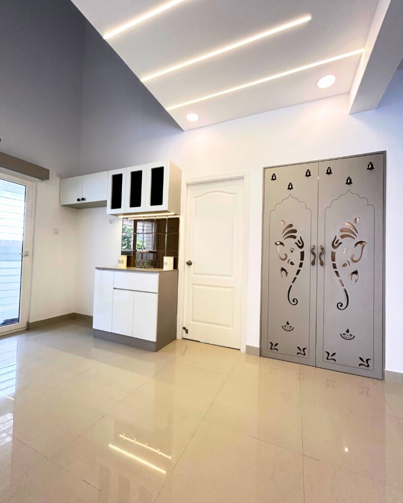 Modern Pooja Room and False Ceiling Design in Chennai Villa
